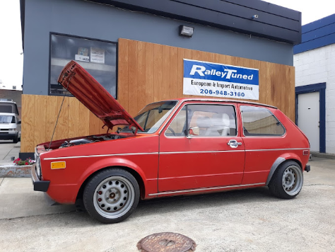 red car getting maintenance